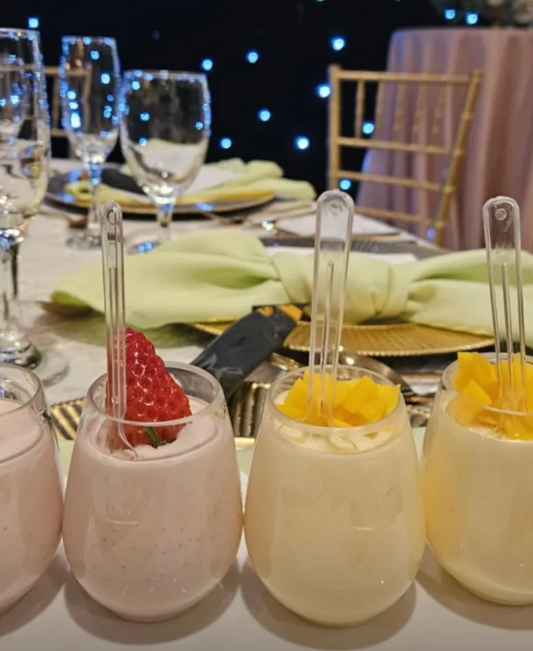 08-strawberry-mango-cups.jpg Strawberry and mango cream cups at a gold-rimmed place setting
