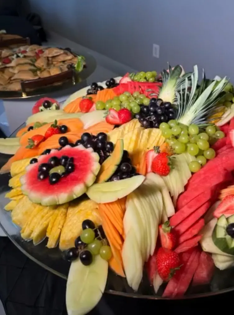 05-fruit-platter-watermelon-flower.jpg Fruit platter with a carved watermelon flower, pineapple, melon and grapes